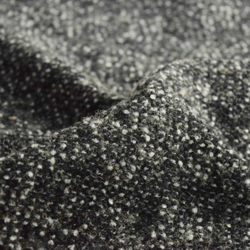 30%羊毛30%睛論40%滌給520克梭織黑白毛圈呢